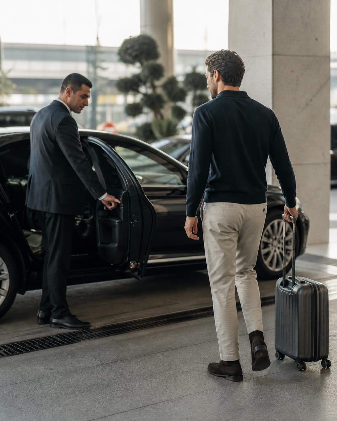 A private driver welcoming a Buji guest at the airport