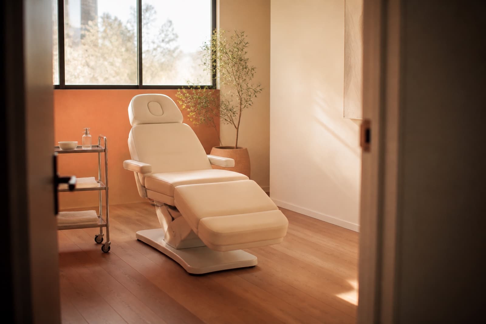 A calm, empty treatment room with a single chair
